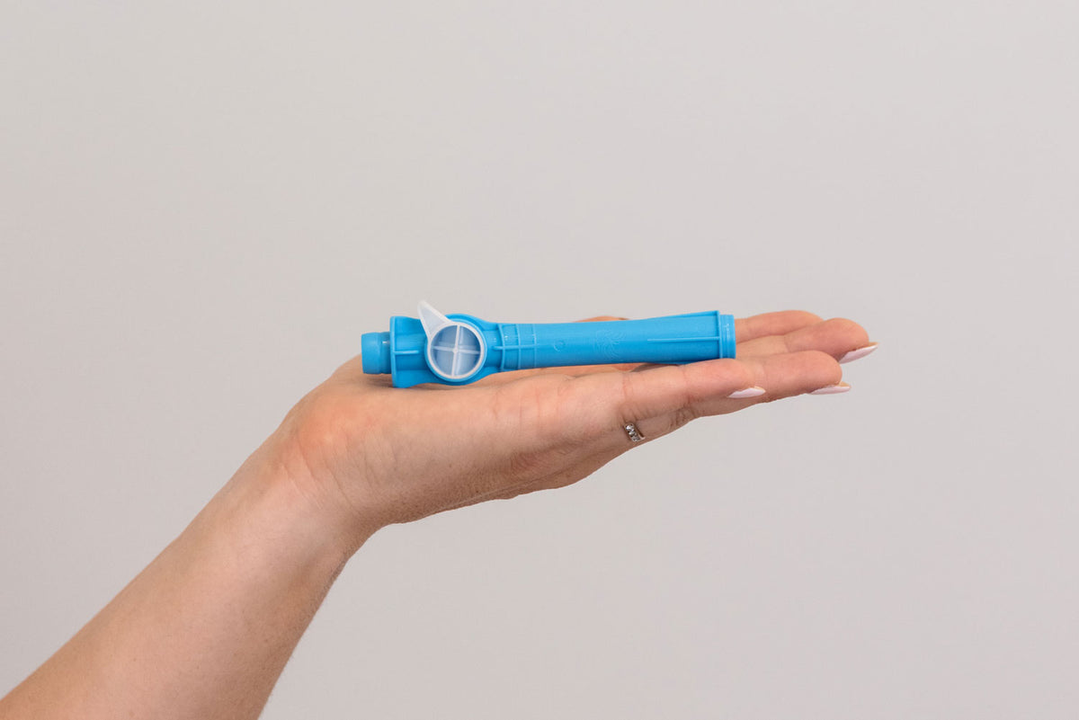 A person's hand holding a blue dental device against a plain light gray background. #Neck Length_Long #Barb Size_Small #Barb Size_Medium