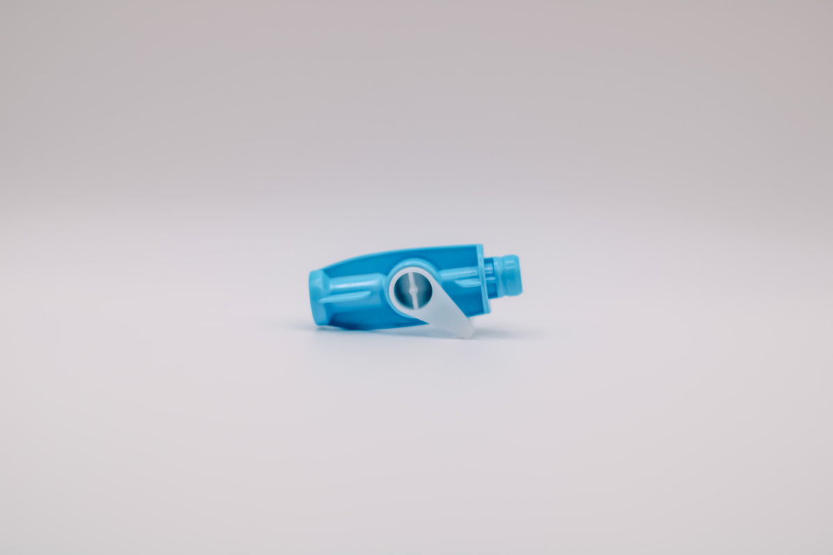 Blue plastic dental valve on a gray background #Product_SE Valve #Color_Blue